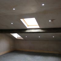 Insulated plastered sloped ceiling room