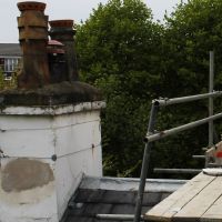 Damaged render before removing chimney