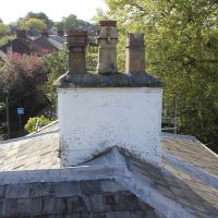 Damaged render before restoring chimney