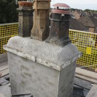 Fully beaded and scratch coated chimney stack and flange